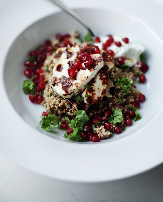 A warm salad with halloumi, spiced up quinoa, pomegranate seeds and lots of parsley.